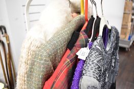 A selection of vintage and retro ladies clothing including heavily beaded tops, checked jacket,