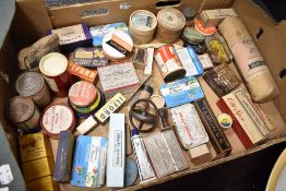A selection of pharmacy and chemist bottles, tins and packets