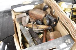 A selection of various hardware including razor, mallet and lamp
