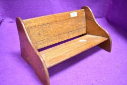 A vintage oak book trough or shelf