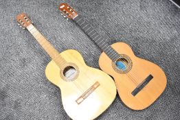 Two vintage Spanish guitars, small sizes, labelled BM Clasico and Hermanos Rodriguez