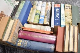 A selection of hard back text and reference books including adventure literature
