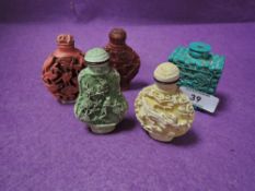 A selection of Chinese snuff bottles in cinnabar styles