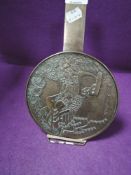 A Japanese brass cast mirror fan having scene of waterfall and carp with character inscription and