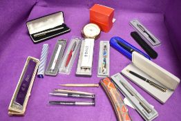 A selection of ink and ball point pens including Parker and rolled gold propelling pencil