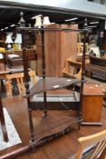 A reproduction mahogany corner whatnot