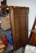 An Edwardian oak framed bed with irons