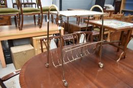 A vintage wirework magazine rack