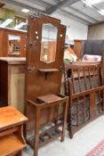 An Edwardian hall way cloak or coat stand with original hooks and mirror back