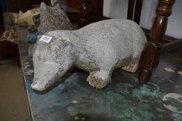 A concrete garden ornament, modelled as a badger