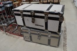 Two vintage flight case style trunks