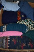 A box full of ladies retro knitwear, some having tags still attached,chunky styles and patterned