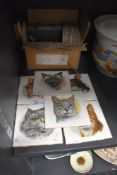 Six kitsch cat theme printed tiles circa 1950 and similar black satin glazed tiles 11cmx11cm