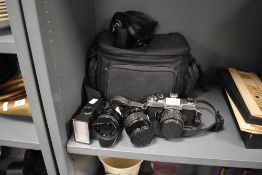 A Fujica STX-1 camera with 50mm lens, a Makinon 135 lens and a Sigma 28mm lens
