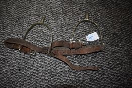A pair of vintage leather and metal spurs.