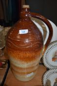 A large salt glazed handled flagon having graduated glaze AF