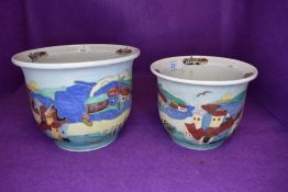 Two porcelain hand decorated studio planters having beach side scenery
