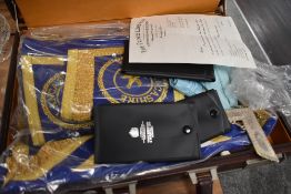 A leather lockable case containing a number of Masonic items and regalia including three medals