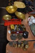 Three sets of kitchen balance scales with approx five sets of various weights including brass and