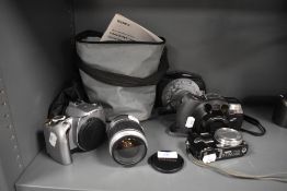 A selection of cameras including a Canon EOS300 with Canon EF28-90mm lens, a Lumix DMC TZ3 digital
