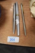 A Sheaffer fountain pen having decorative gold tone band to cap, a Parker ball point and a Chromatic