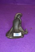 An unusual cast iron ornament depicting a fire side ghost marked JUNO to base