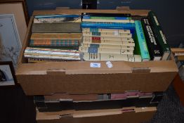 Three box of text and reference books for tax banking and economic theory