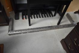A vintage chrome fire fender in the Art Deco style, rust spots, needs rechroming