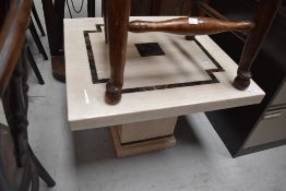 A heavy set low stone effect coffee or display table