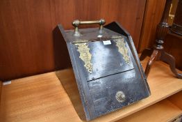 A Victorian stained frame coal purdonium and stoneware bed bottle