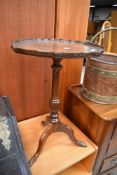 A reproduction mahogany wine table