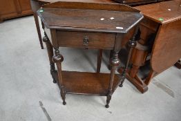 An early 20th Century dark oak hall table, width approx. 66cm