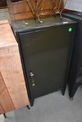 A vintage metal office cabinet , having internal lockable compartments