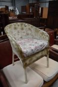 A vintage woven fibre tub chair