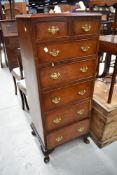 A reproduction narrow chest of two over five drawers, height approx. 120cm