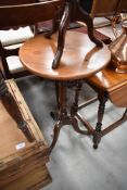 A 19th Century mahogany occasional table having turned column on triple splay legs, possibly later