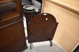 A 1930s Oak fire screen/smokers table