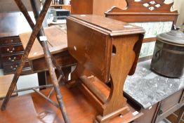 An Arts and Crafts style golden oak drop leaf occasional table, shape nice, top a bit shabby