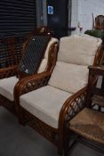 A pair of wicker conservatory chairs