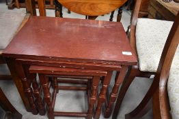 A nest of stained frame tables