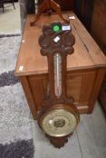 A late 19th or early 20th Century barometer with thermometer scale