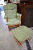 A Dutalier slide action rocking chair and footstool