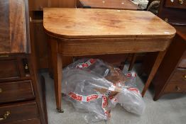 A Victorian bleached mahogany fold over tea table
