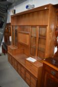 A mid century design wall unit by Nathan having glazed display shelving 190cm long