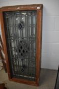 Two framed leaded glass windows with coloured detailing