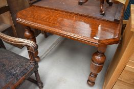 A 19th Century oak windout dining table, having canted top on turned legs, width approx 105cm,