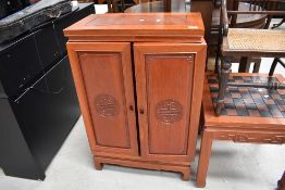 An Oriental hardwood side/drinks cabinet, width approx. 60cm, height 91cm