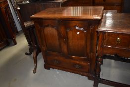 A reproduction oak (believed to be Titchmarsh and Goodwin) TV cabinet width approx 81cm (selling for