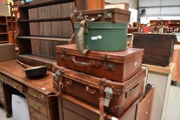 A selection of vintage travel cases including leather
