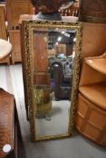 A gilt frame wall mirror of narrow proportions approx. 100 x 39cm